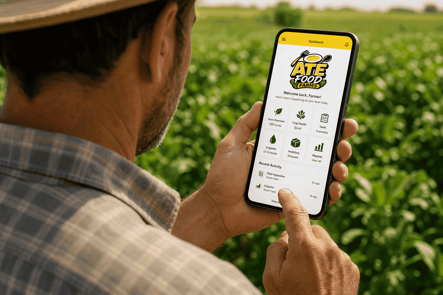 A farmer using the ATE Food Farms app while standing in a green field